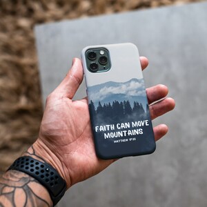 May include: A white iPhone case with a blue and gray mountain scene and the text "Faith can move mountains Matthew 17:20".