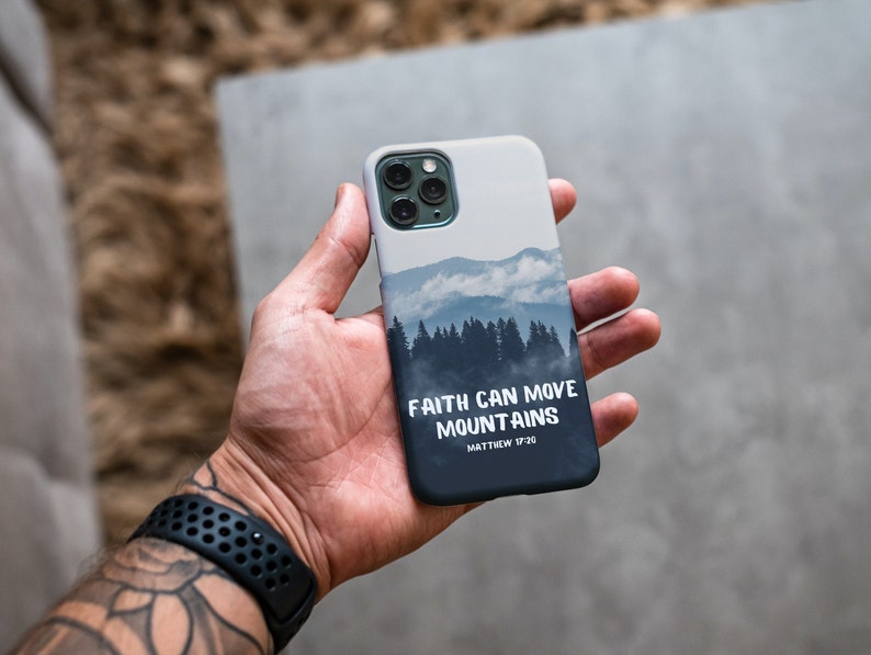 May include: A white iPhone case with a blue and gray mountain scene and the text "Faith can move mountains Matthew 17:20".