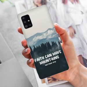 May include: A phone case with a blue and white mountain landscape and the text "FAITH CAN MOVE MOUNTAINS MATTHEW 17:20".