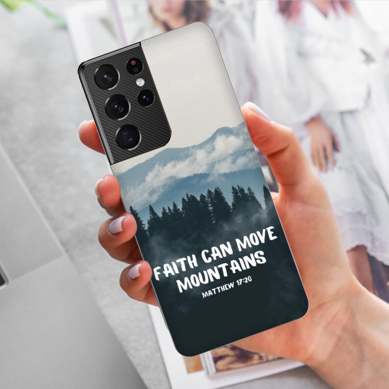May include: A phone case with a blue and white mountain scene and the text "Faith can move mountains Matthew 17:20".