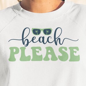 May include: White sweatshirt with green text that says "beach PLEASE" and a pair of blue sunglasses with palm trees on the lenses.