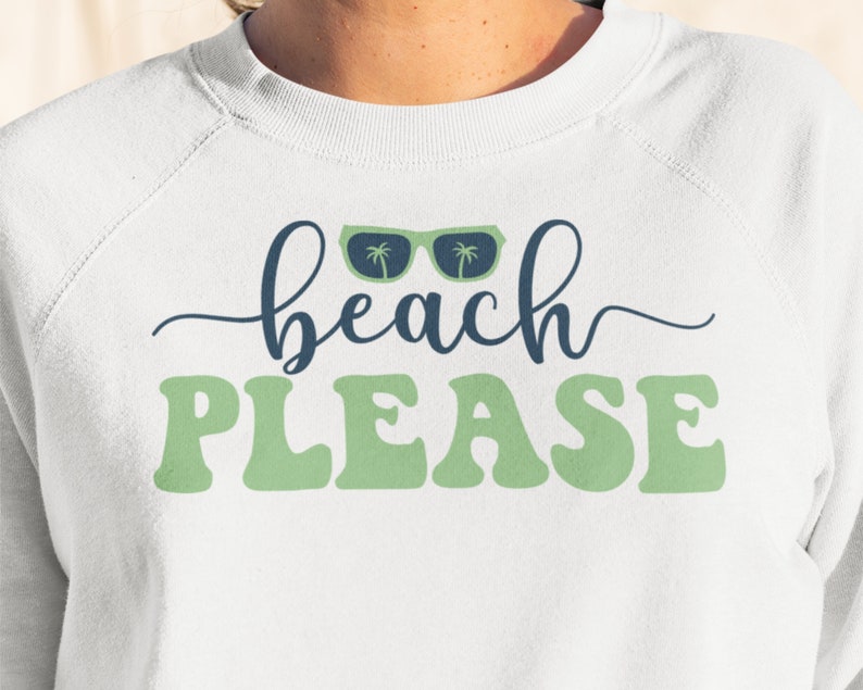 May include: White sweatshirt with green text that says "beach PLEASE" and a pair of blue sunglasses with palm trees on the lenses.