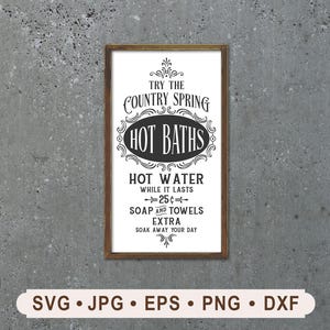 May include: A framed sign with the text "Try the Country Spring Hot Baths." The sign is in black and white with decorative flourishes. The bottom of the sign reads "Hot Water while it lasts - 25¢ - Soap and Towels Extra - Soak Away Your Day."