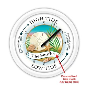 May include: A white personalized tide clock with a seashell design. The clock face features a sand dollar, starfish, and palm leaves. The clock face also includes the text "HIGH TIDE", "LOW TIDE", "RISING TIDE", and "FALLING TIDE". The clock is personalized with the name "The Smiths".