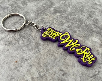 Still We Rise Lewis Hamilton F1 Keychain, F1, Formula One, Motorsport, Rubber Keyring, 2D Keychain Car Pendant, Car Accessory, Gifts For Her