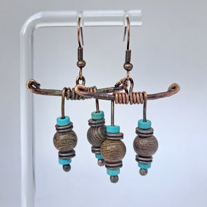 Copper hammered earrings, hand forged and unique, with hanging natural turquoise beads. A perfect gift with rustic charm and earthy elegance