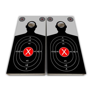 May include: Two black and white target boards with a silhouette of a person in the center. The target has concentric circles with the numbers -1, +2, +1, -1+2+1, X, +1+2-1, +1, +2, -1 printed on them. The center of the target is marked with a red X.