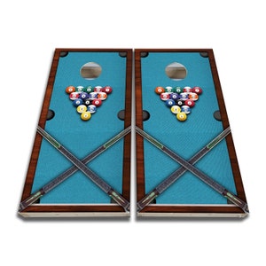 May include: Two wooden pool table-themed cornhole boards with a blue felt surface, a set of billiard balls in a triangle formation, and crossed pool cues.