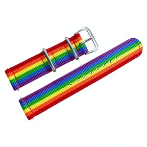 May include: A rainbow striped watch strap with a silver buckle. The strap is made of nylon and has a woven design.