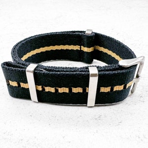 May include: Black watch strap with two thin yellow stripes and silver hardware.
