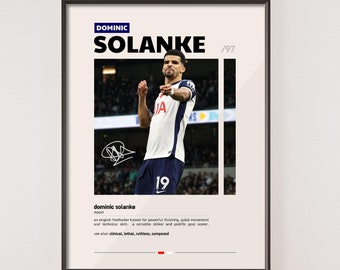 May include: A black and white poster with a photo of a soccer player in a white jersey with a blue and white logo. The player is celebrating a goal. The poster has the text "DOMINIC SOLANKE '97" at the top and a definition of the word "dominic solanke" at the bottom.