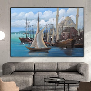 May include: A painting depicting a harbour scene with several sailboats on the water. The boats are brown and white, and the water is blue. There are buildings in the background, including a mosque with a dome and minarets.