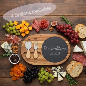 May include: A wooden cheese board with a black slate insert, engraved with "The Williams Est. 2025". The board is surrounded by various cheeses, grapes, meats, and crackers. Includes two cheese knives. The text "4 Options Available" is in the upper left.