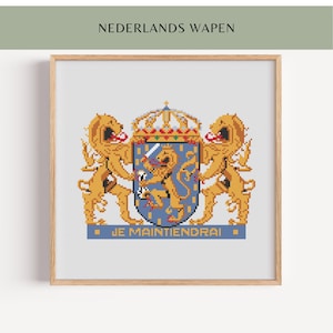 May include: A framed cross-stitch of the Dutch coat of arms. The design features two golden lions flanking a blue shield with a golden lion holding a sword. The text "JE MAINTIENDRAI" is at the bottom, with "NEDERLANDS WAPEN" at the top.