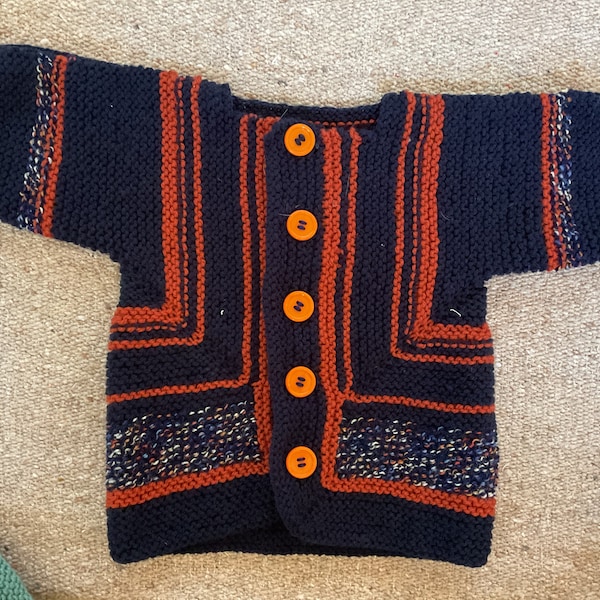 Unique hand knitted baby  'surprise' jacket up to 1 year