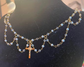 White and clear beaded looping St Benedict crucifix necklace - gold tone
