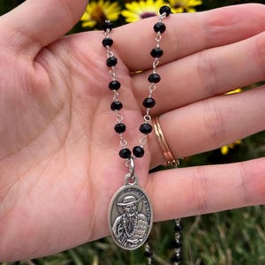Saint Damien of Molokai - black beaded necklace - silver tone