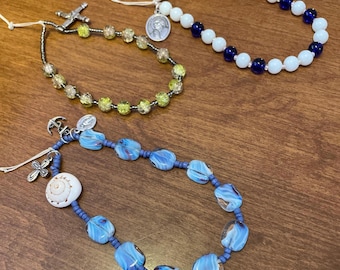 Catholic phone case wristlets - 3 styles - Our Lady Star of the Sea, Saint Teresa of Calcutta, & Saint Brigid of Kildare