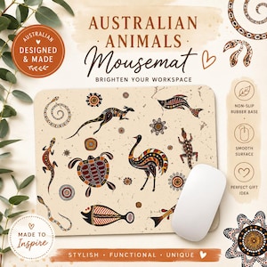 May include: A rectangular mousemat featuring a cream-coloured background with brown, black, and orange illustrations of Australian animals including a kangaroo, emu, turtle, lizard, and fish, with the text Australian Animals Mousemat.