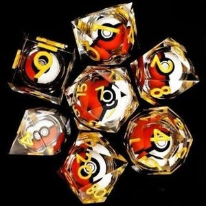 May include: Seven polyhedral dice with a red, white, and black design, encased in clear resin. Each die features a yellow number. The dice are arranged on a black surface. The dice are designed to look like a Pokeball.