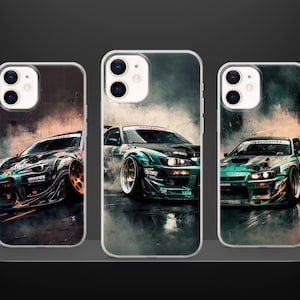 May include: Three phone cases with different designs featuring a green and black car with smoke coming from the tires. The car is in the center of the image and the background is a blurry image of a city street.