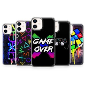 May include: Five different iPhone cases with neon-colored designs. The designs include a game controller, a Rubik's cube, geometric shapes, and the words "Game Over".
