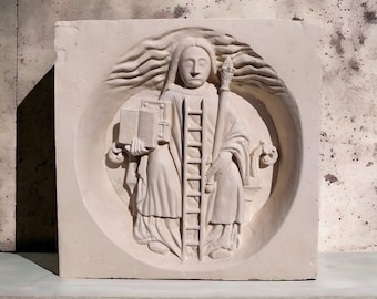 May include: A white plaster relief sculpture of a person holding a book and a ladder, with flowing hair and a staff. The sculpture is set in a circular frame.