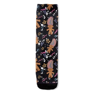 May include: A pair of black socks with a colourful pattern of cartoon trolls, stars, hearts, and squiggly lines.
