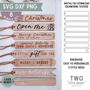 May include: A set of eight laser-cut wooden Christmas gift tags with various festive designs and text, including "Christmas", "Open Me", "Merry Christmas", "Special Delivery", "A Little Gift", "Merry & Bright", and "Happy Holidays". The tags are designed for easy personalization and come with three style ideas. The tags are laser-ready and perfect for crafting.