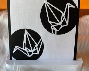 Handmade greeting card with a flight of cranes