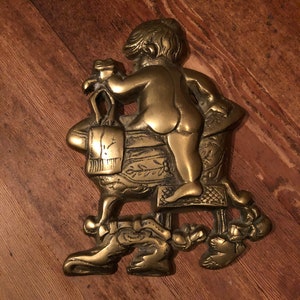 Vintage brass bathroom decor brass ornate retro sign small child with frog stepping into tub
