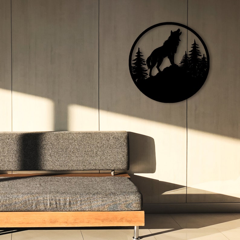 May include: Black metal wall art featuring a wolf howling at the moon with a forest silhouette in the background.