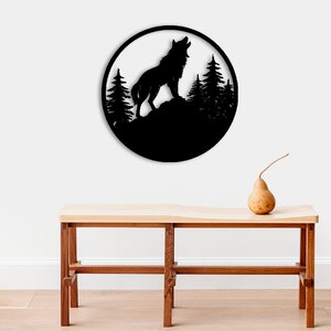 May include: Black metal wall art featuring a wolf howling at the moon with a forest silhouette in the background.