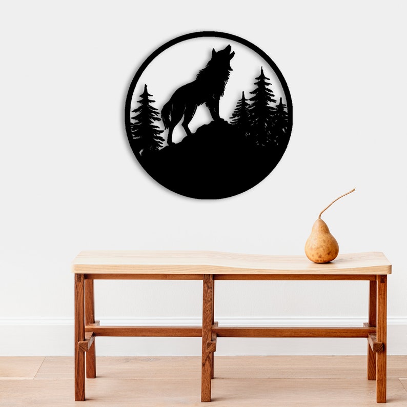 May include: Black metal wall art featuring a wolf howling at the moon with a forest silhouette in the background.