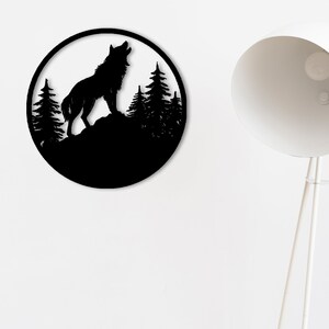 May include: Black metal wall art featuring a silhouette of a wolf howling at the moon in a forest setting.