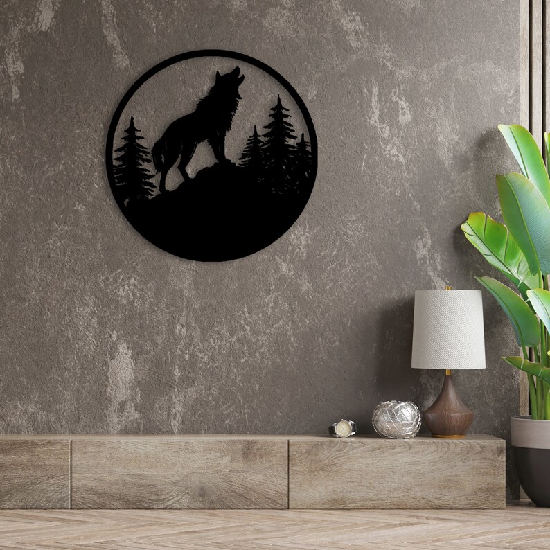 May include: Black metal wall art featuring a silhouette of a wolf howling at the moon with trees in the background.