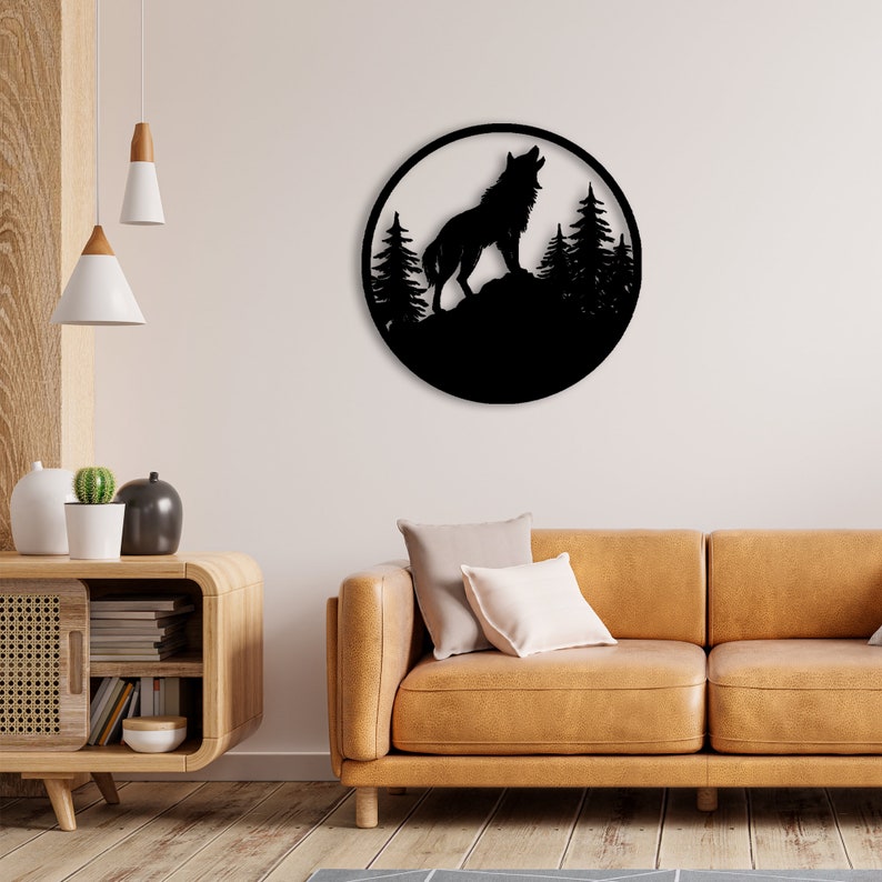 May include: Black metal wall art featuring a silhouette of a wolf howling at the moon with trees in the background.
