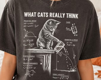 What Cats Really Think Shirt, Funny Cat Physics Tee, Cat Knocking Glass Graphic Shirt, Whimsical Science Cat Humor Gift, Funny Cat Lover Tee