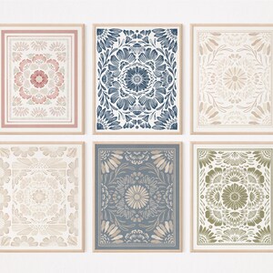 May include: Set of six framed prints featuring intricate floral patterns in shades of pink, blue, green, and beige. The prints have a vintage, hand-drawn aesthetic and would add a touch of bohemian charm to any room.