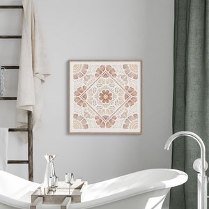 May include: A framed print of a geometric design with a mandala-like pattern in shades of brown and beige. The design features intricate floral motifs and a central flower.