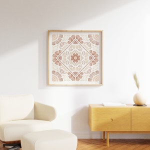 May include: A framed print with a geometric pattern in shades of brown and beige. The pattern is a symmetrical design of overlapping flower shapes.