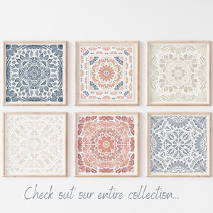 May include: Six framed prints with intricate mandala designs in shades of blue, beige, and pink. The prints are arranged in a grid pattern on a white wall.