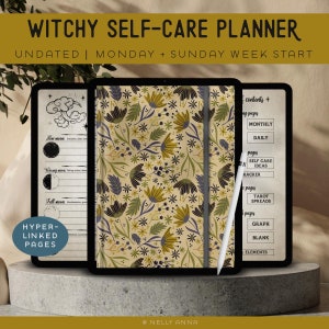 Könnte beinhalten: Ein digitaler Planer mit einem floralen Muster auf dem Cover. Der Planer ist auf einer Seite mit einer Inhaltsliste geöffnet, darunter monatliche, tägliche, Selbstpflege-Ideen, Tarot-Spreads, Grafiken, leere Seiten und Elemente. Der Planer liegt auf einer grauen Oberfläche mit einem weißen Stift.