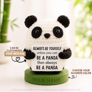 May include: A white and black crocheted panda figurine holding a square sign that reads: ALWAYS BE YOURSELF unless you can BE A PANDA then always BE A PANDA. The panda sits on a round green base with the text YOUR NAME engraved on the front.