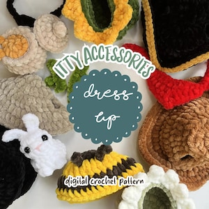 May include: A collection of various crocheted items including a white rabbit, a yellow and black bee, a brown hat, a red accessory, and green floral pieces. The image features the text ITTY ACCESSORIES dress up digital crochet Pattern.