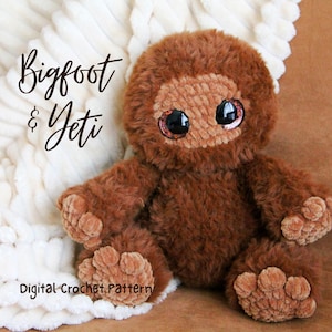 May include: A brown Bigfoot and Yeti plush toy with large, expressive eyes. The plush toy is made of soft, textured material and has a friendly, inviting appearance. The text "Bigfoot & Yeti" and "Digital Crochet Pattern" are visible.