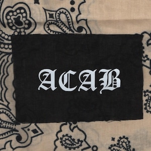 May include: A black bandana with a white patch that says "ACAB" in a gothic font.