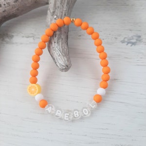 Bracelet " APEROL " with orange, acrylic beads, plastic letters, strung on elastic band, orange + white, handmade