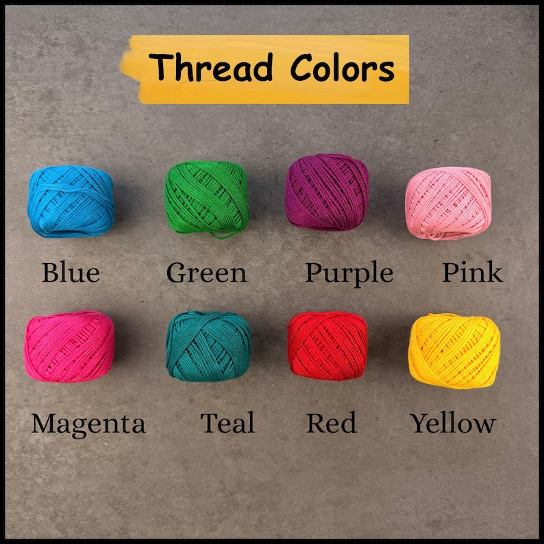 May include: Eight small balls of embroidery thread arranged in two rows, labeled with the text Thread Colors. The colors include blue, green, purple, pink, magenta, teal, red, and yellow. Each ball is a solid, vibrant color with a visible texture.