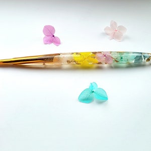 Petals of the Valley, real dried flowers in Resin Crochet Hook with gold flakes and petals inside